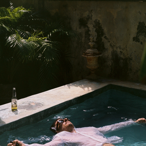 Man in the pool wearing Tech Linen Button Up shirt